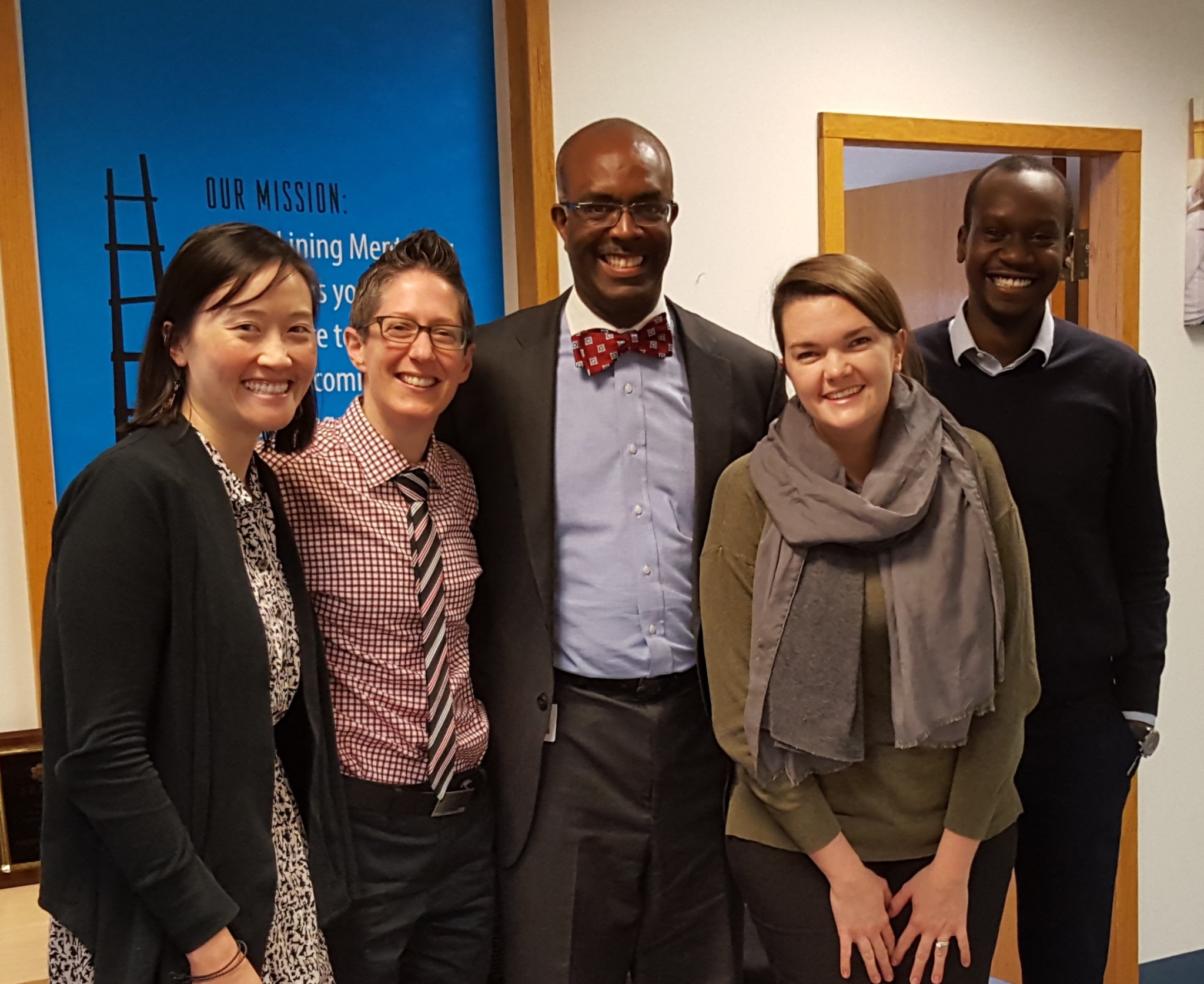 Roy Bates (center) with Silver Lining Mentoring Staff: Director of Evaluation and Strategy Melissa Birke Chu,CEO Colby Swettberg, Director of Programs Alaina Rosenberry, and Outreach Coordinator Brian Diah